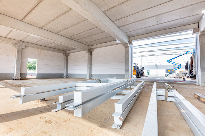 Warehouse Construction Site And Steel Profiles. Industrial Building